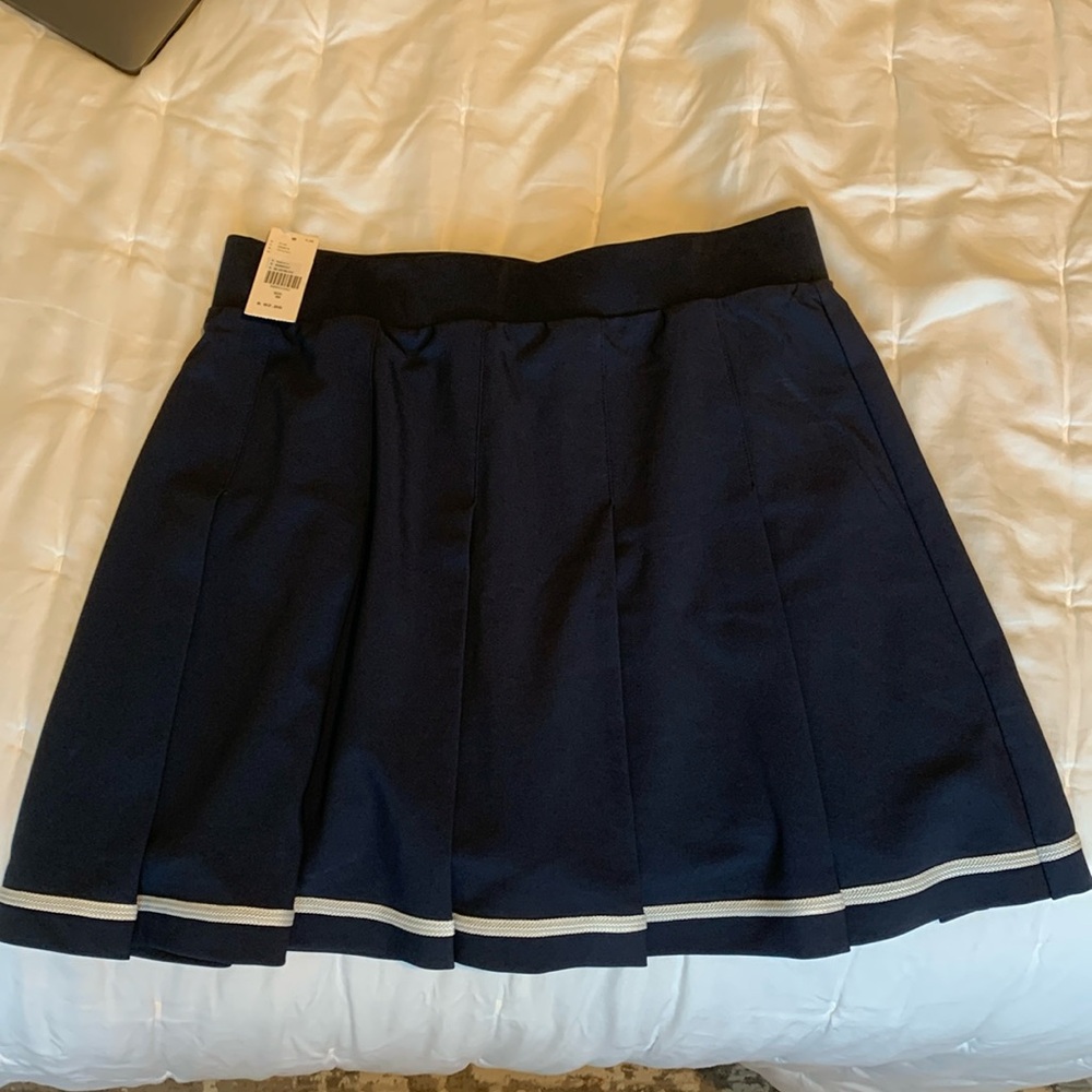 Varley tennis skirt in navy from Anthropogie in Medium